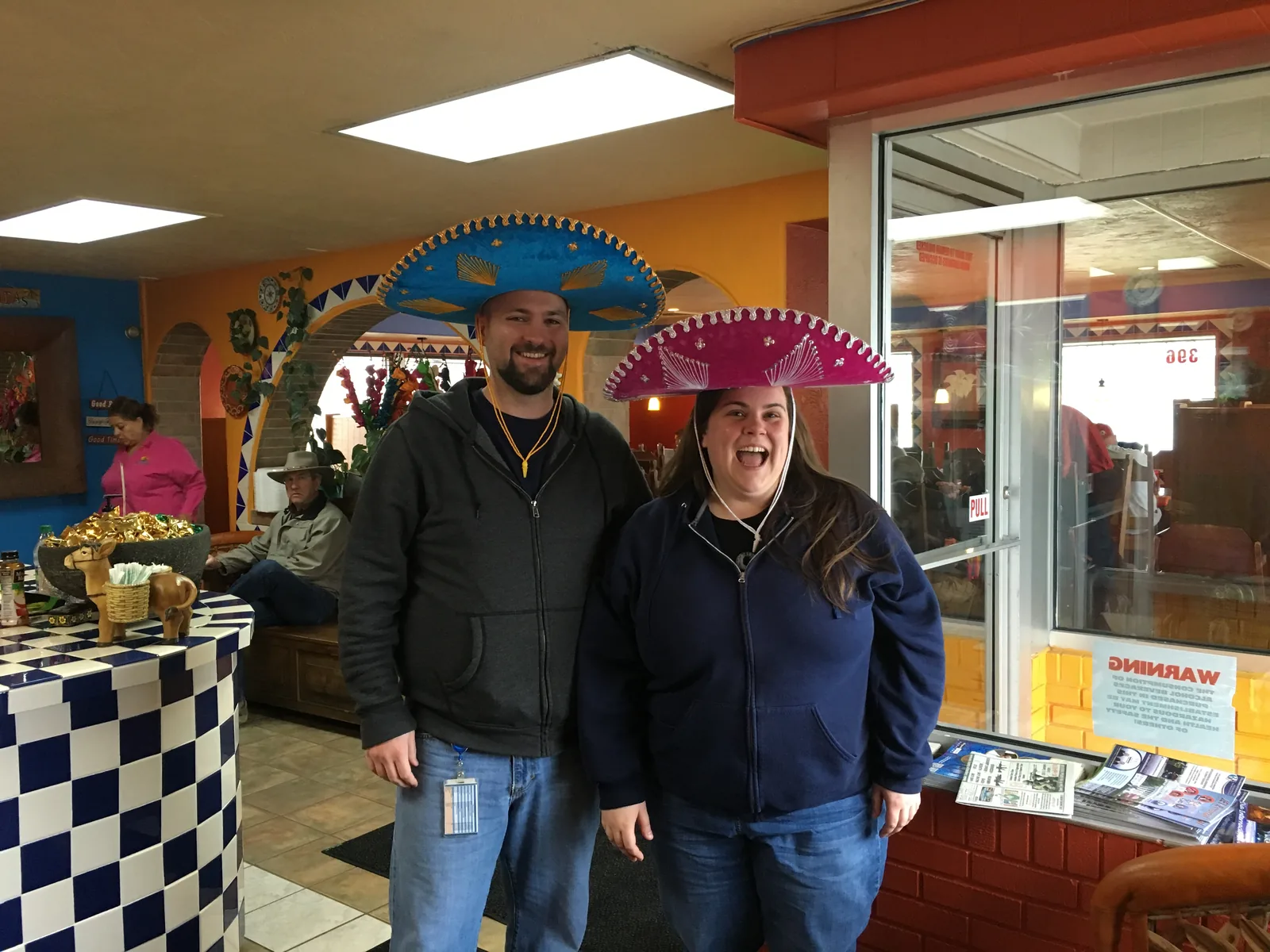 Nick and Heather in 2016, before losing over 100 pounds each